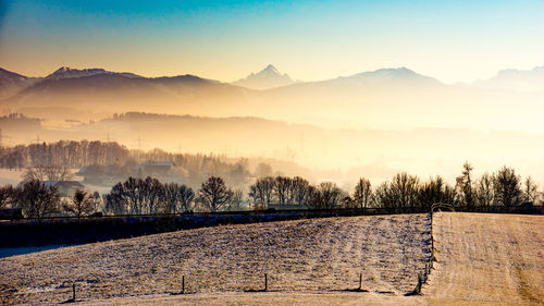 Scenic view of silhouette mountains against sky