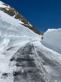 Snow covered mountain against clear sky