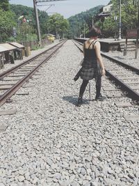 Woman walking on footpath