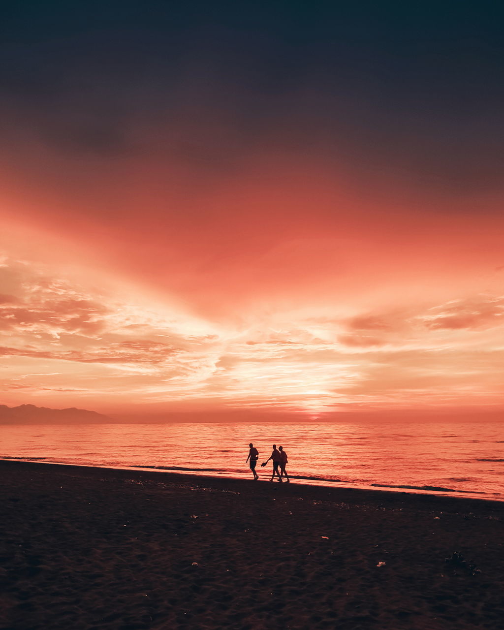 sky, sea, sunset, beach, water, beauty in nature, land, scenics - nature, two people, silhouette, real people, horizon over water, togetherness, horizon, orange color, lifestyles, leisure activity, cloud - sky, men, positive emotion, couple - relationship