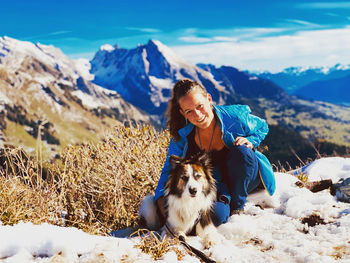 Woman with dog in snow