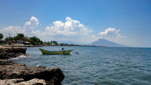 Scenic view of sea against blue sky