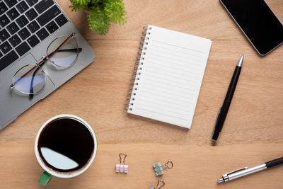 High angle view of coffee cup on table