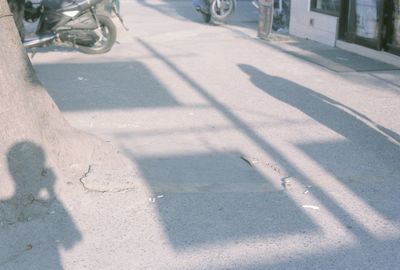 Shadow of people on road