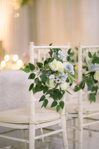 Wooden chairs decorated whit paper flowers