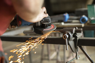 Close-up of man working in factory