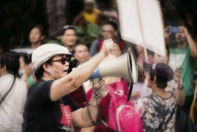 People standing in front of crowd