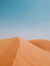 Scenic view of desert against clear sky