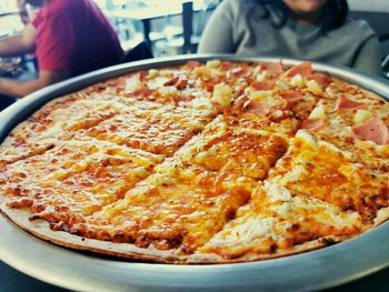 Close-up of pizza served on table