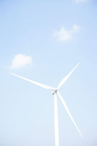 Low angle view of wind turbine against sky