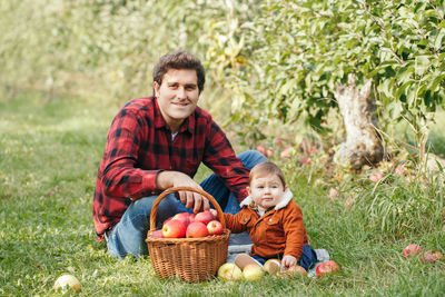 Portrait of happy mother and daughter in basket