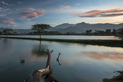 Scenic view of lake against sky during sunset