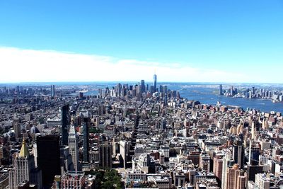 High angle view of city buildings against sky