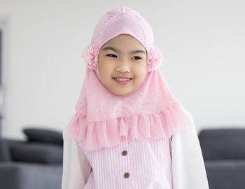 Portrait of happy little muslim girls child with hijab dress smi person