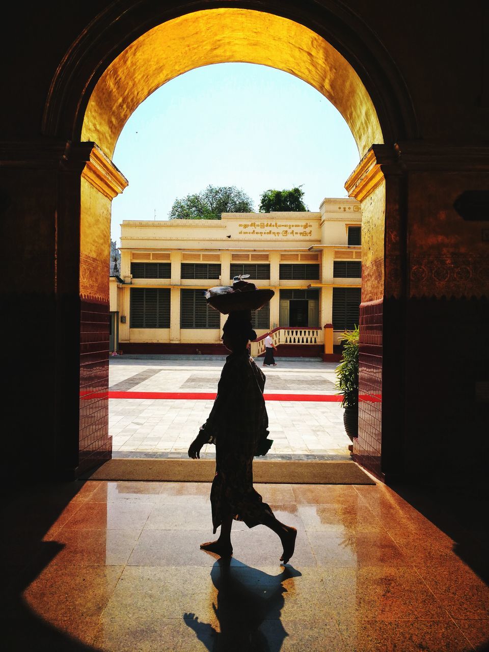 architecture, arch, full length, built structure, one person, real people, indoors, clothing, men, the past, history, building, day, architectural column, childhood, lifestyles, standing, uniform, women, human arm, arms raised