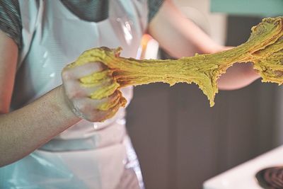 Midsection of woman holding ice cream