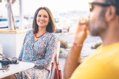 Portrait of smiling young woman outdoors