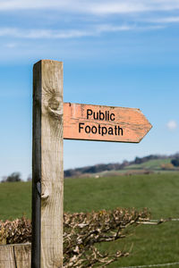 Information sign on wooden post