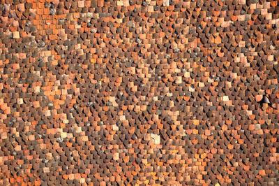 Pattern of old tile roof. background of house roof tiles