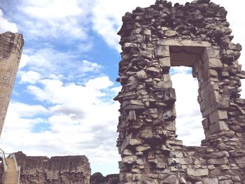 Low angle view of old ruin building against sky