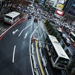 High angle view of people and vehicles on street