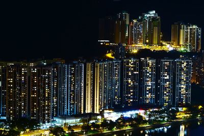 Illuminated buildings against clear sky