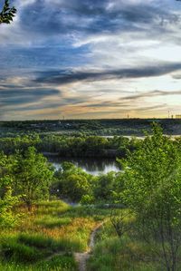 Scenic view of landscape against cloudy sky