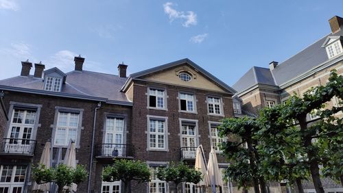 Buildings in city against sky