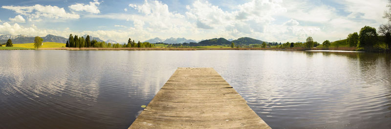 Wooden jetty pier in beautiful lake