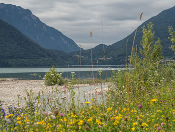 Scenic view of sea and mountains against sky