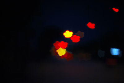 Defocused image of illuminated lights at night