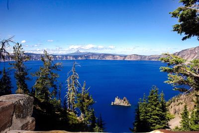 Scenic view of lake against blue sky