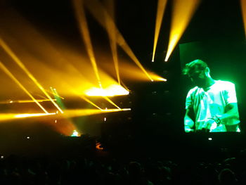 Man performing at music concert