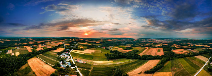Aerial view of agricultural field against sky during sunset