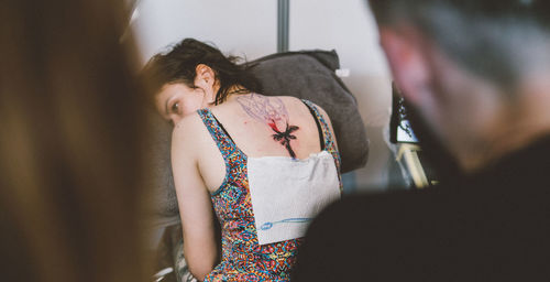 Young woman relaxing on sofa at home