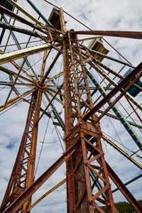 Low angle view of crane against sky