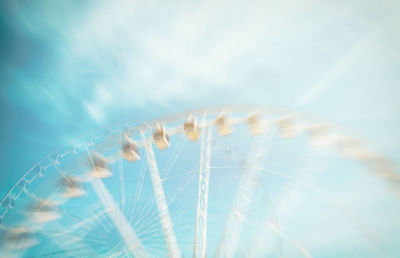 Low angle view of ferris wheel against sky