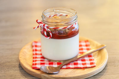 Close-up of drink in glass jar on table