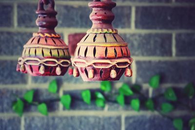Close-up of multi colored lanterns hanging on wall