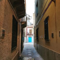 Narrow alley along buildings