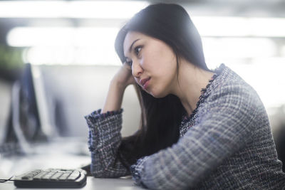 Young asia woman with paper in an office revised