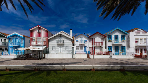 Row of houses against blue sky