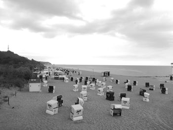 High angle view of chairs on beach against sky