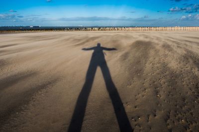 Shadow of people on beach