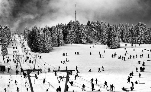 Group of people on snow covered landscape