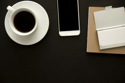 High angle view of coffee cup on table