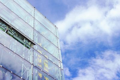 Low angle view of building against cloudy sky