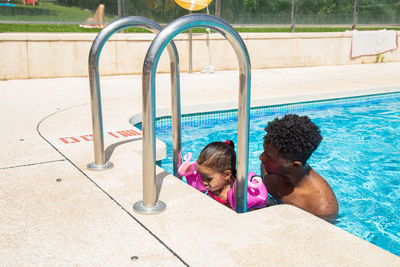 Portrait of boy playing in pool