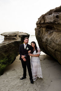 Young couple standing on rock