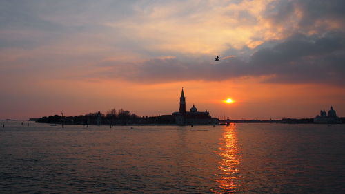 Silhouette of city at sunset